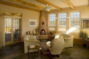 Mur_living_room_kiva_fireplace_pella_window_french_door_slate_floor_exposed_beam_ceiling_structural_insulated_panel_sip_nicho