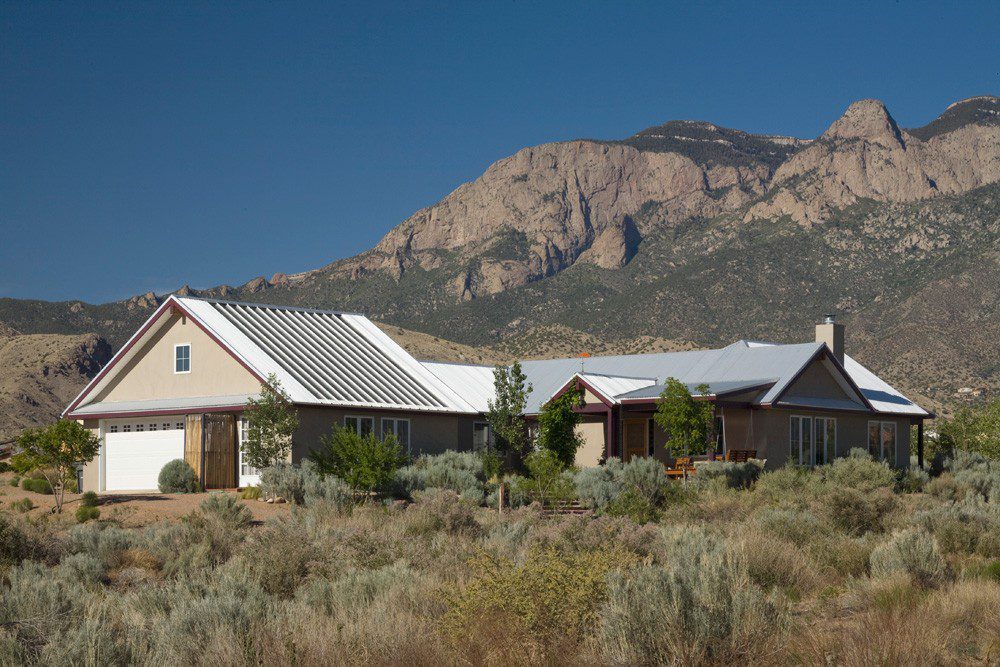 9701-exterior-northern-new-mexico-gable-corrugated-metal-roof-thin-film-photovoltaic-sandia-mountains_sm